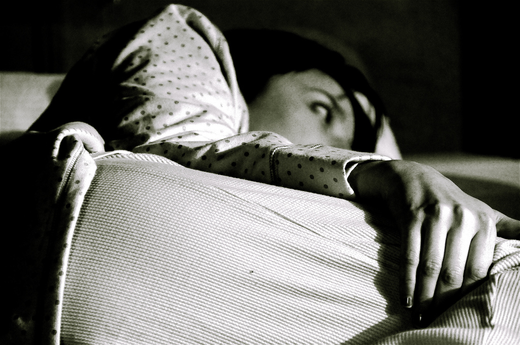 Young woman unable to sleep